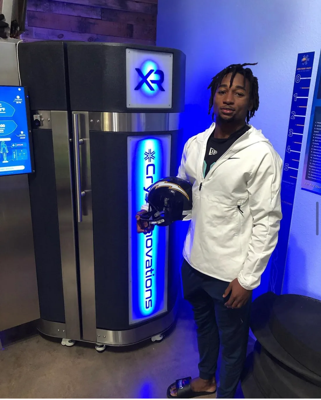 Professional athlete with his helmet beside an XR chamber install